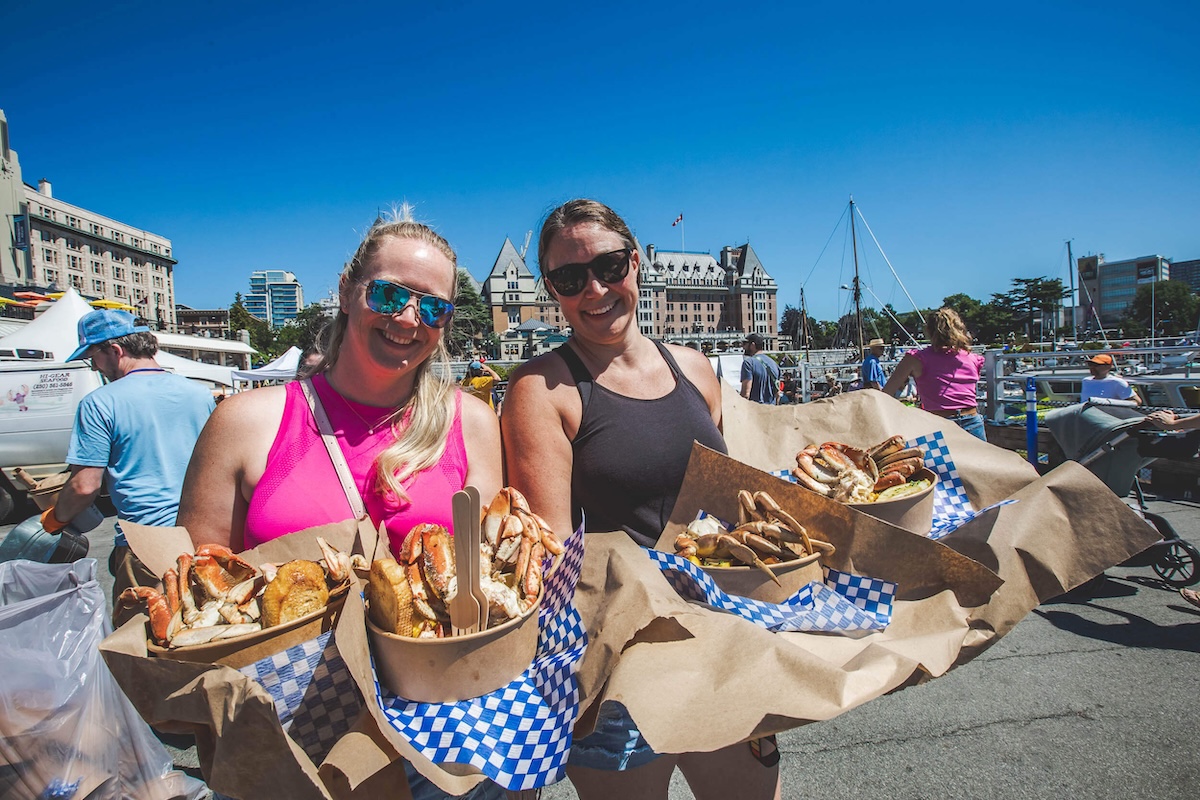 BC CrabFest at Victoria's Inner Harbour with the Empress Hotel and Canada sign in the background